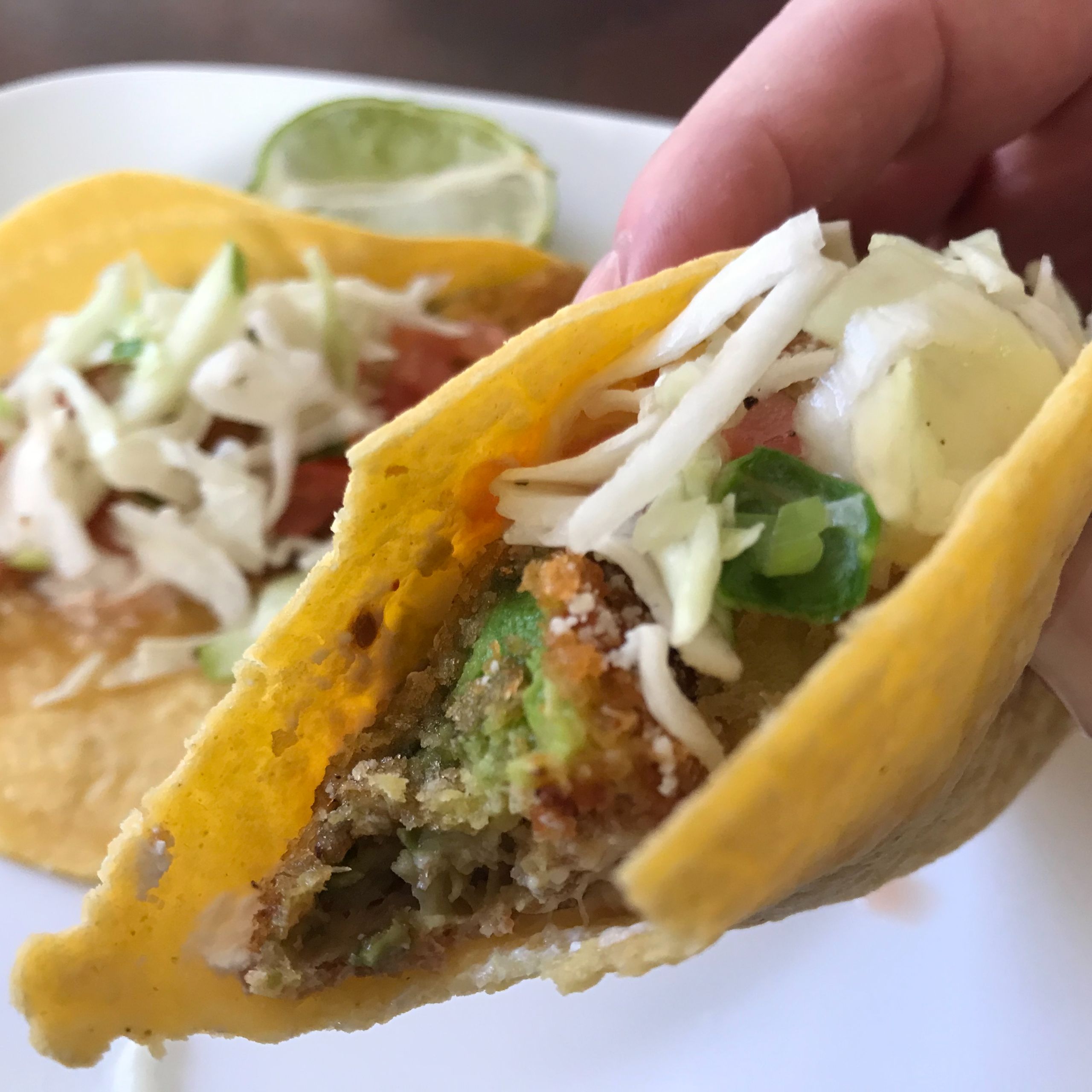 taco with a bite taken out | my curated tastes