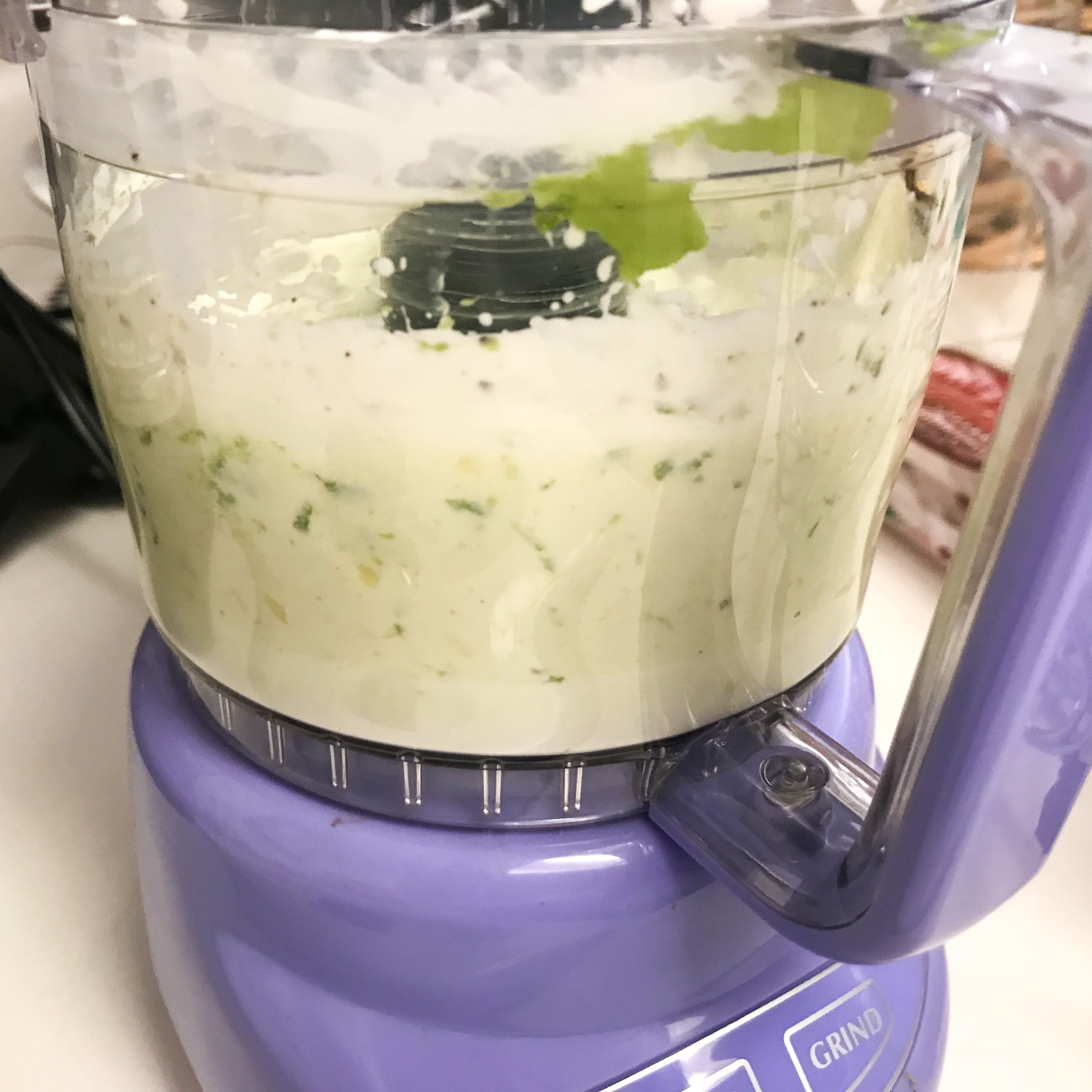 avocado lime crema being blended in blender | my curated tastes