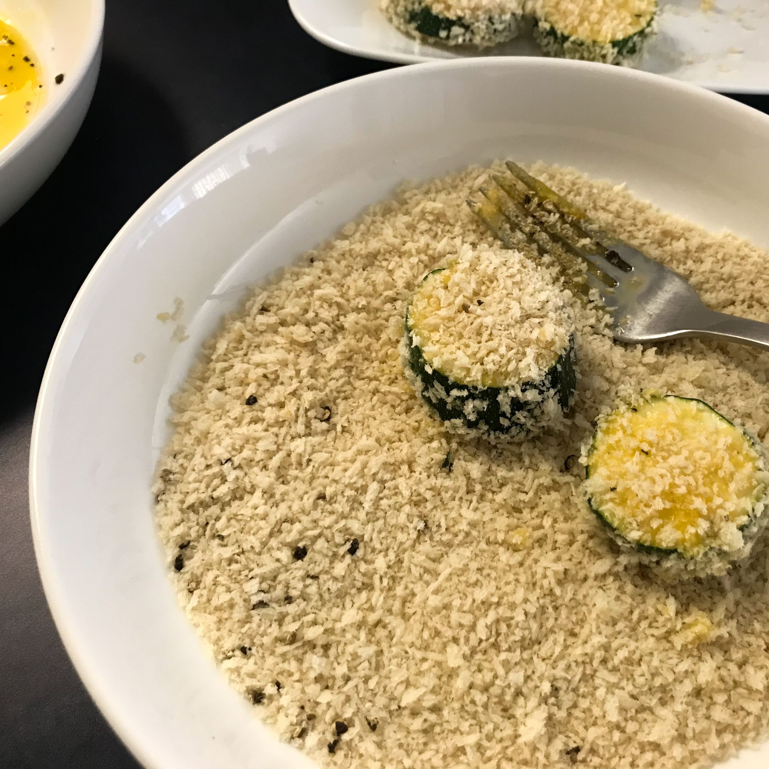 zucchini in bowl of panko | my curated tastes