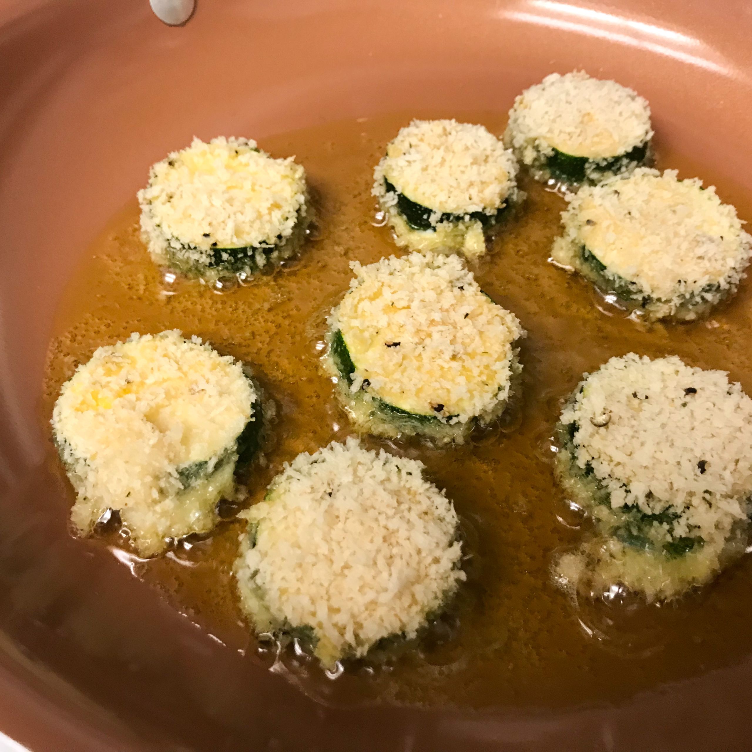 zucchini frying in pan | my curated tastes