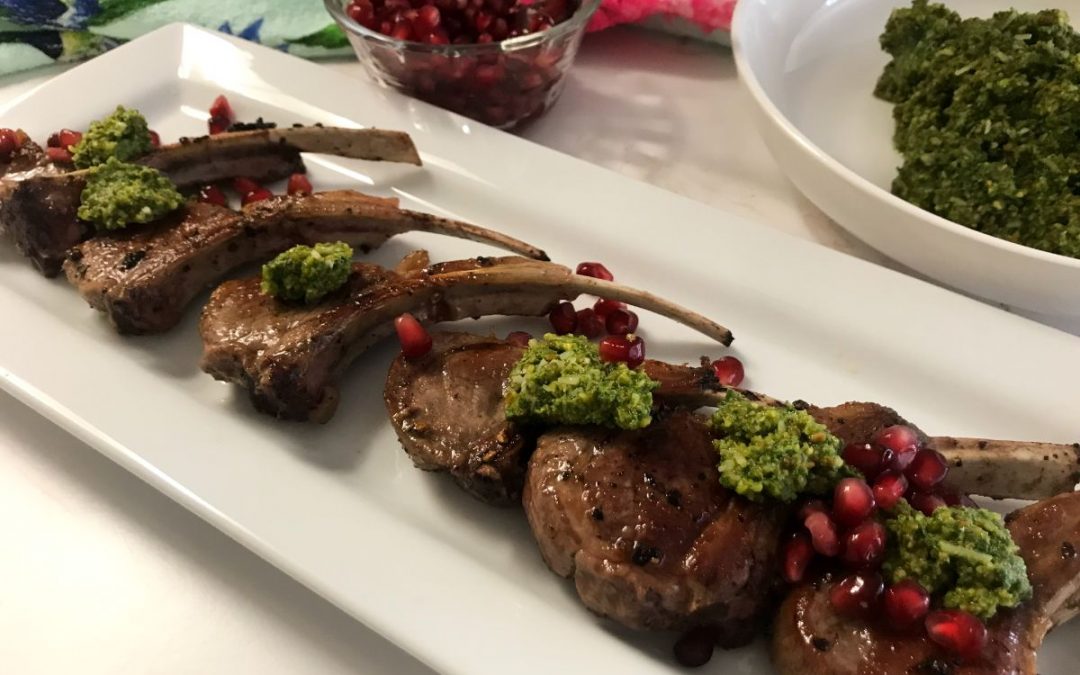 platter of lollipop lamb chops with pesto and pomegranate seeds | my curated tastes