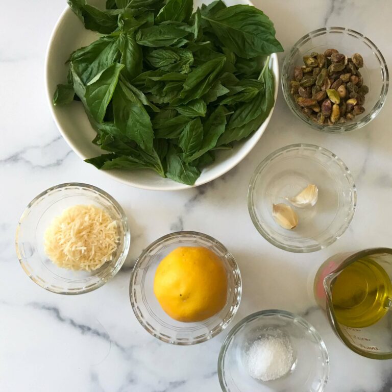 ingredients for pesto in bowls.