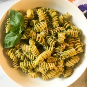 bowl of rotini pasta with pesto.