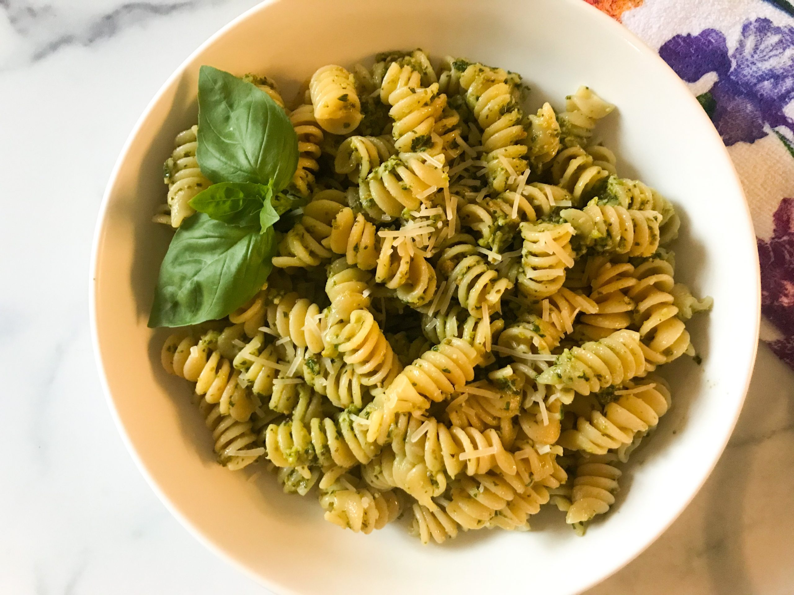 bowl of pasta with pistachio basil pesto | my curated tastes
