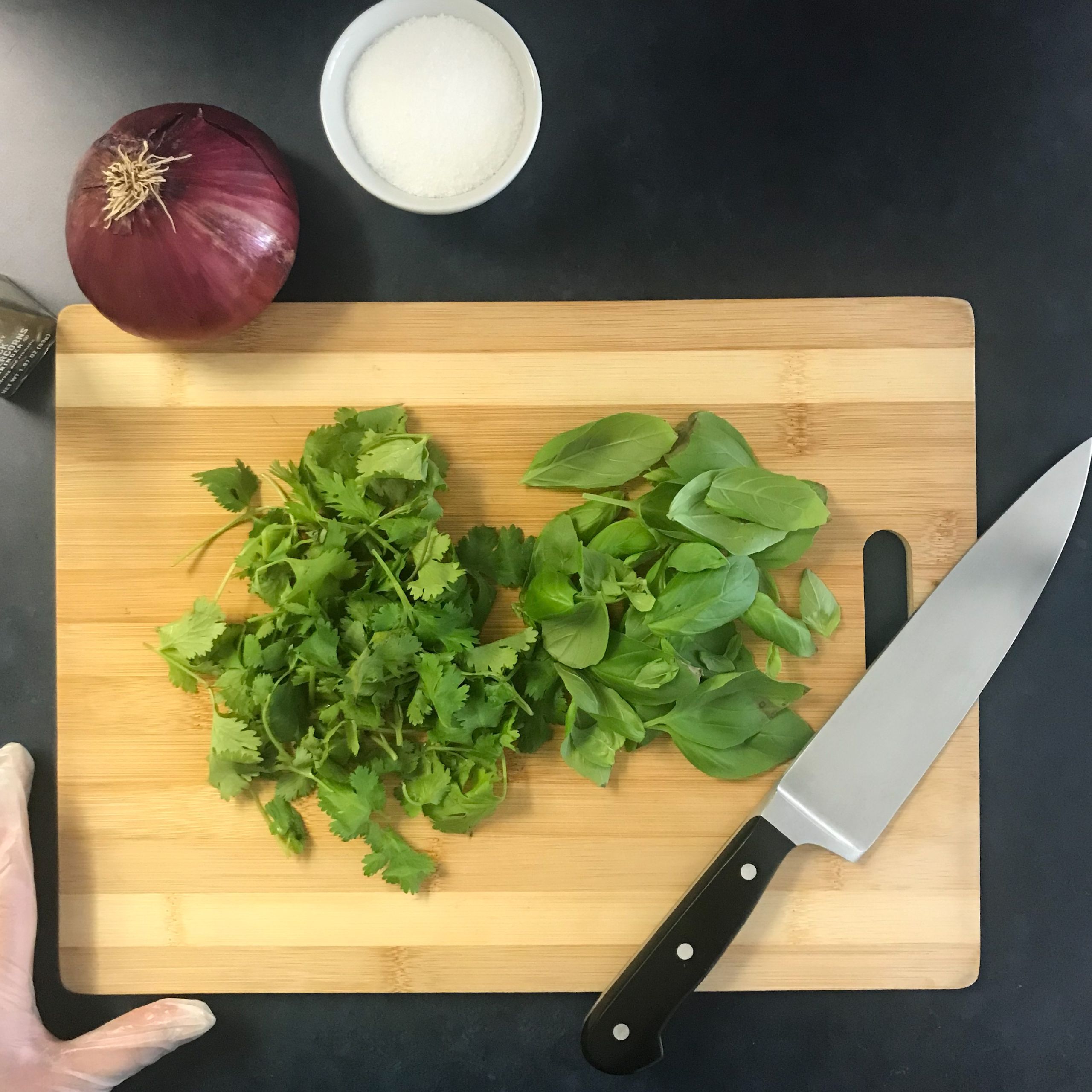 parsley and basil on chopping board | My Curated Tastes