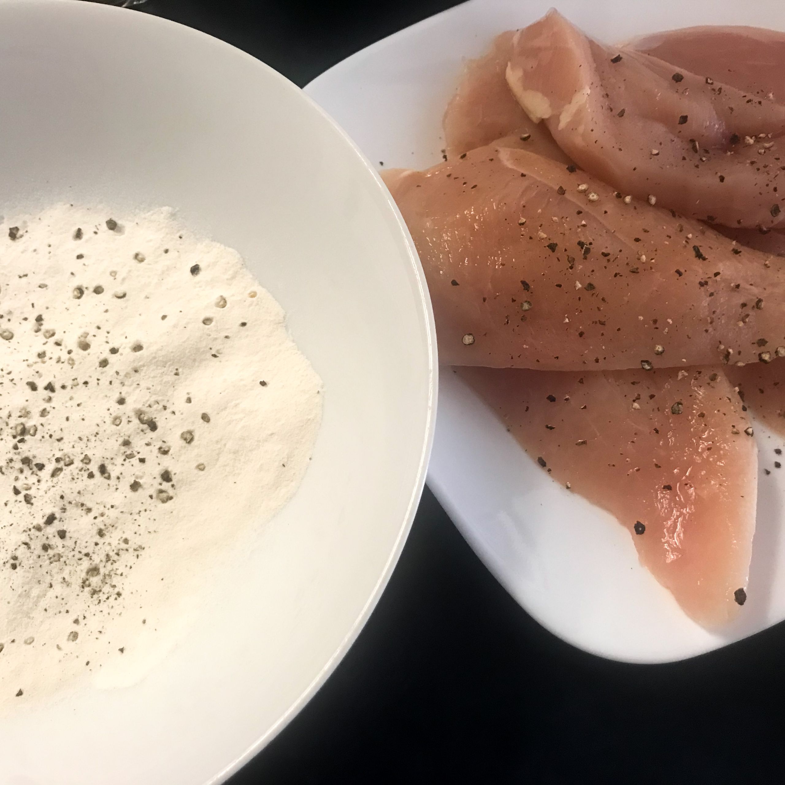 raw chicken and bowl of seasoned flour