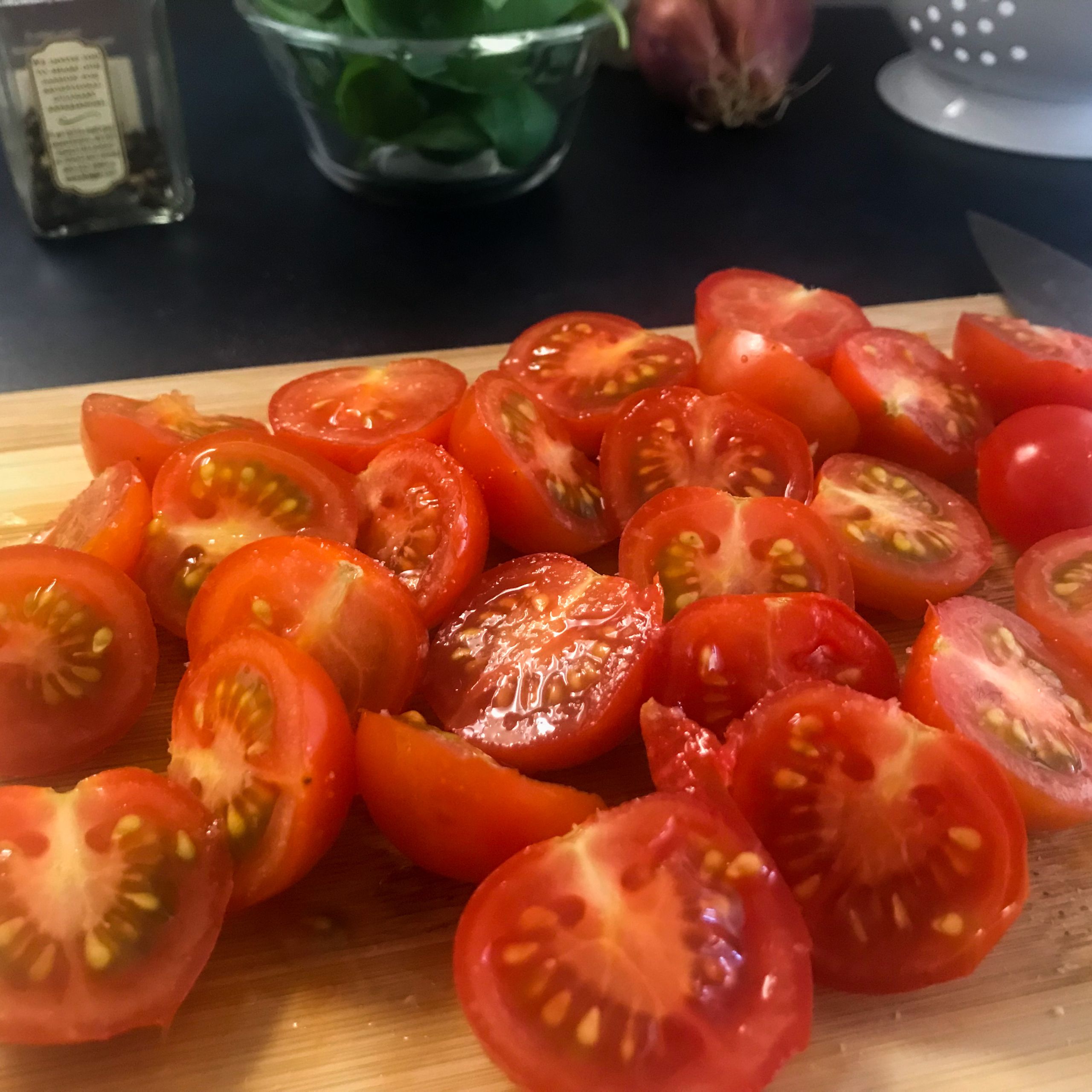 cut tomatoes on a cutting board
