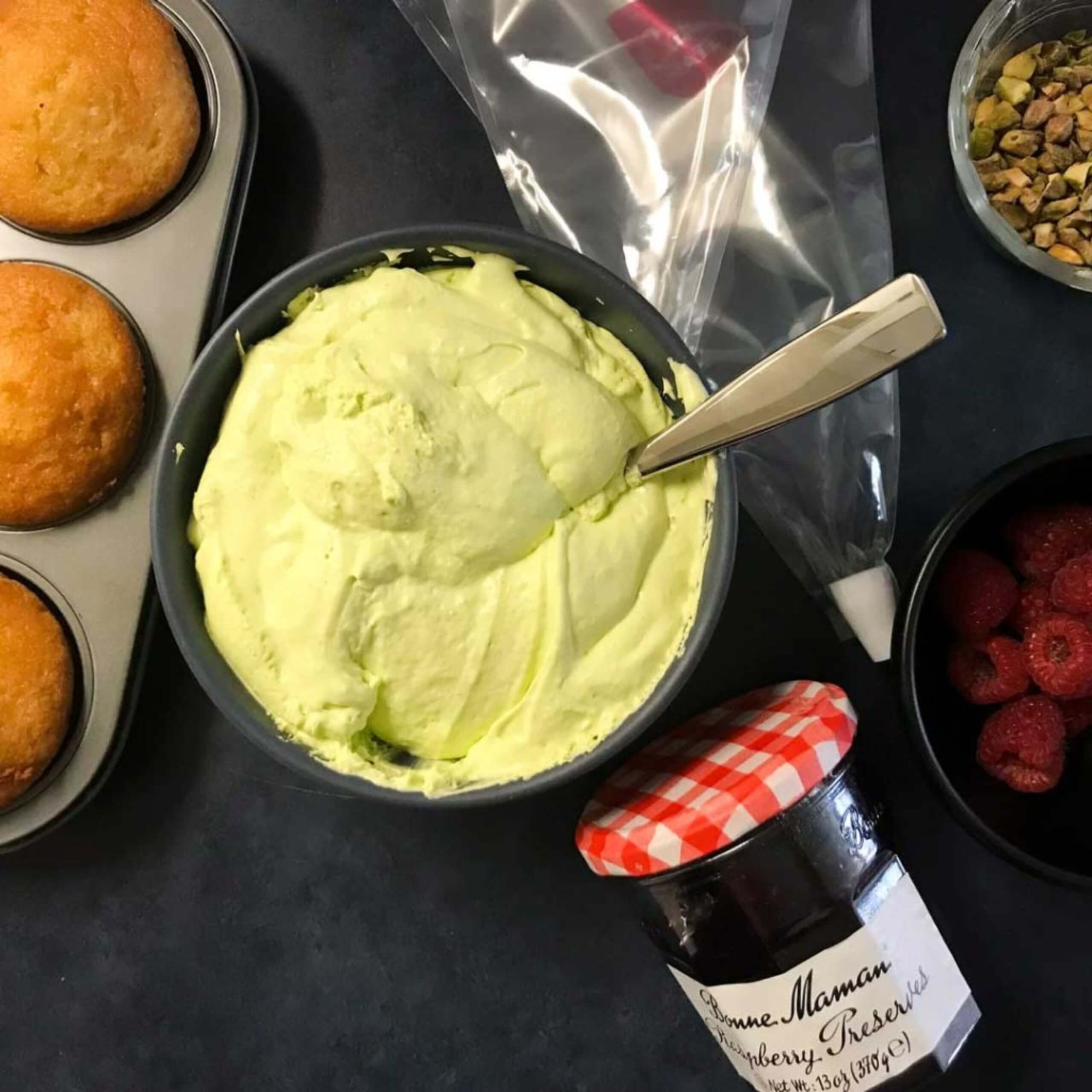 Vanilla Cupcakes with Raspberry Filling and Pistachio Whipped Cream | My Curated Tastes
