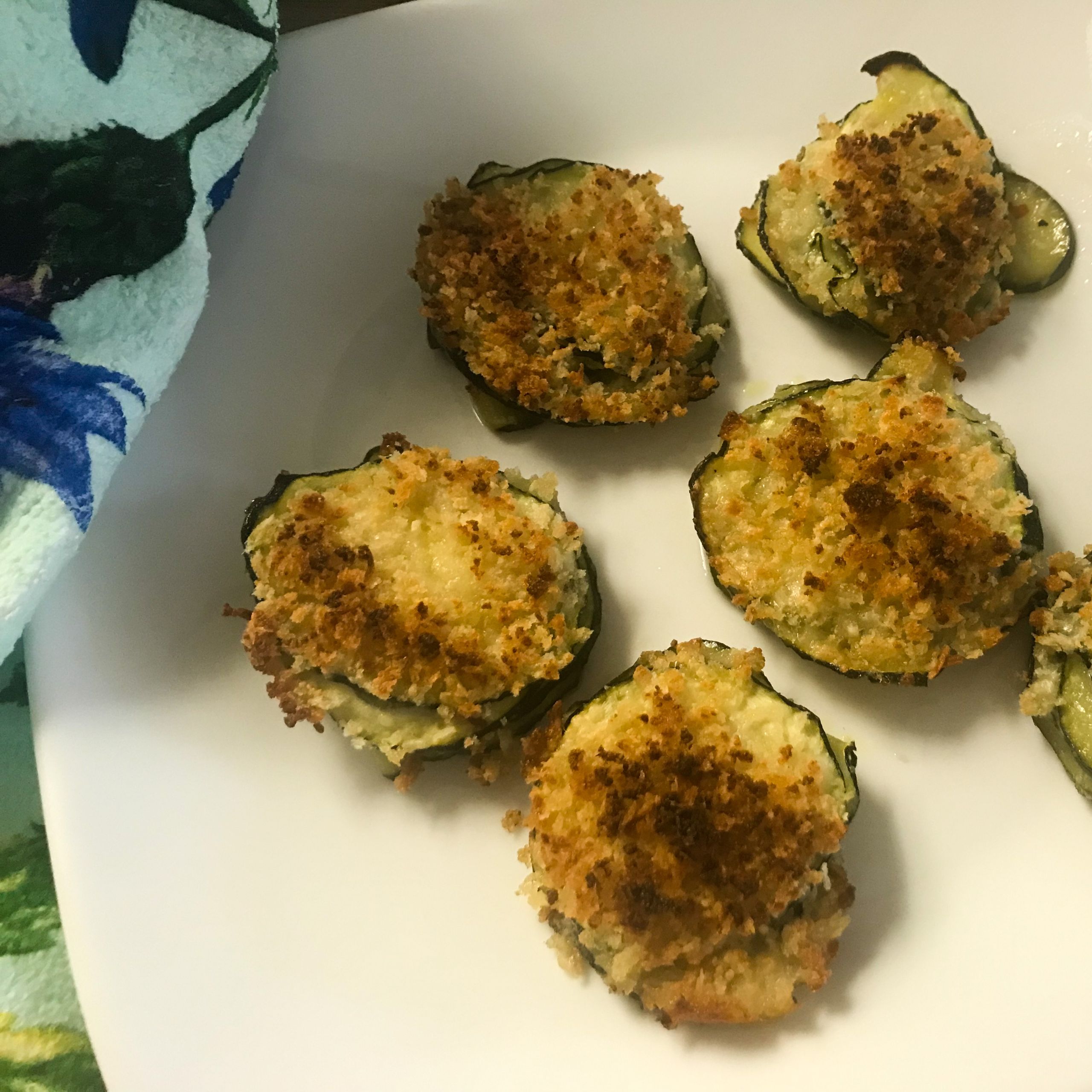 cooked zucchini stacks on a plate