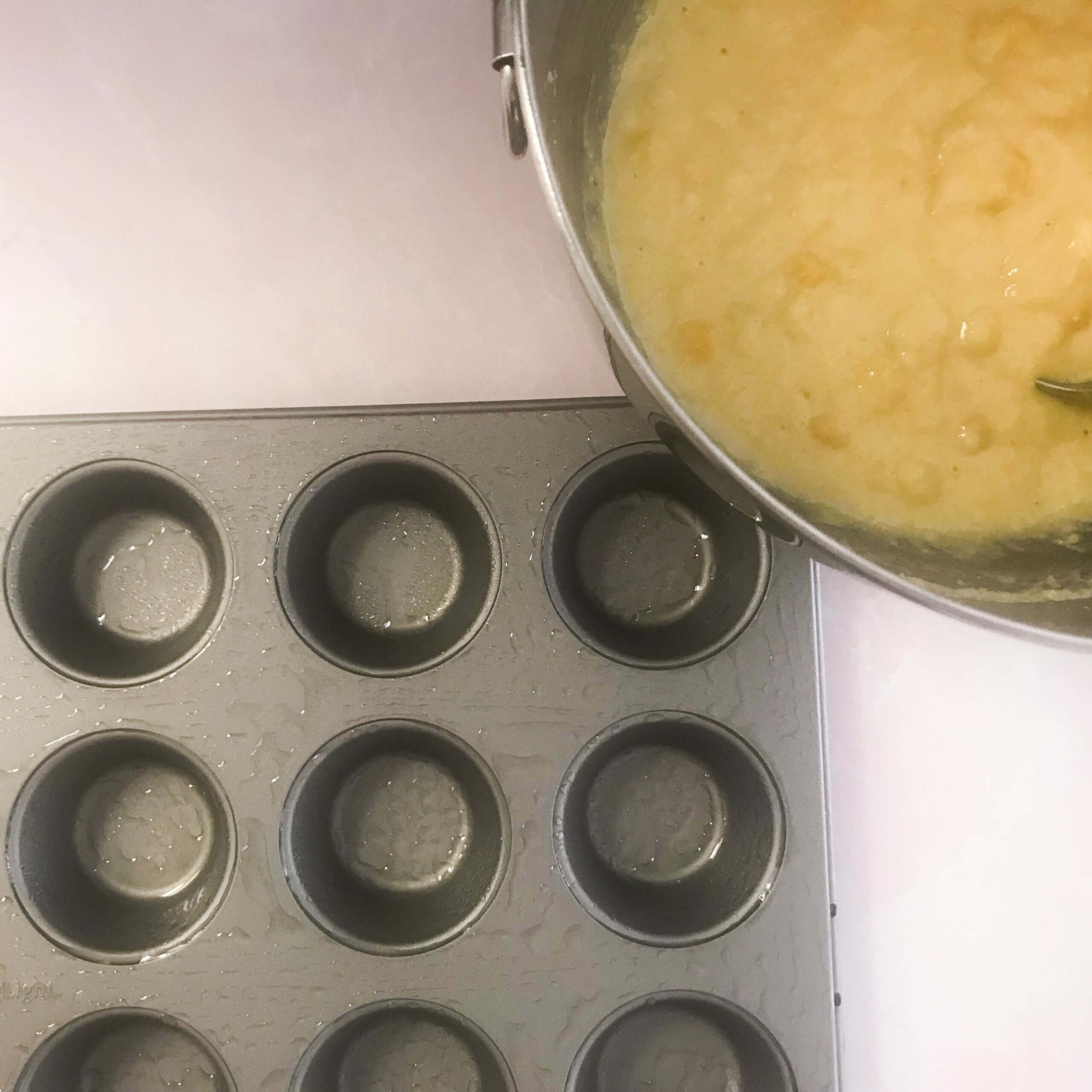 MUFFIN TIN AND BOWL OF CORN MIX