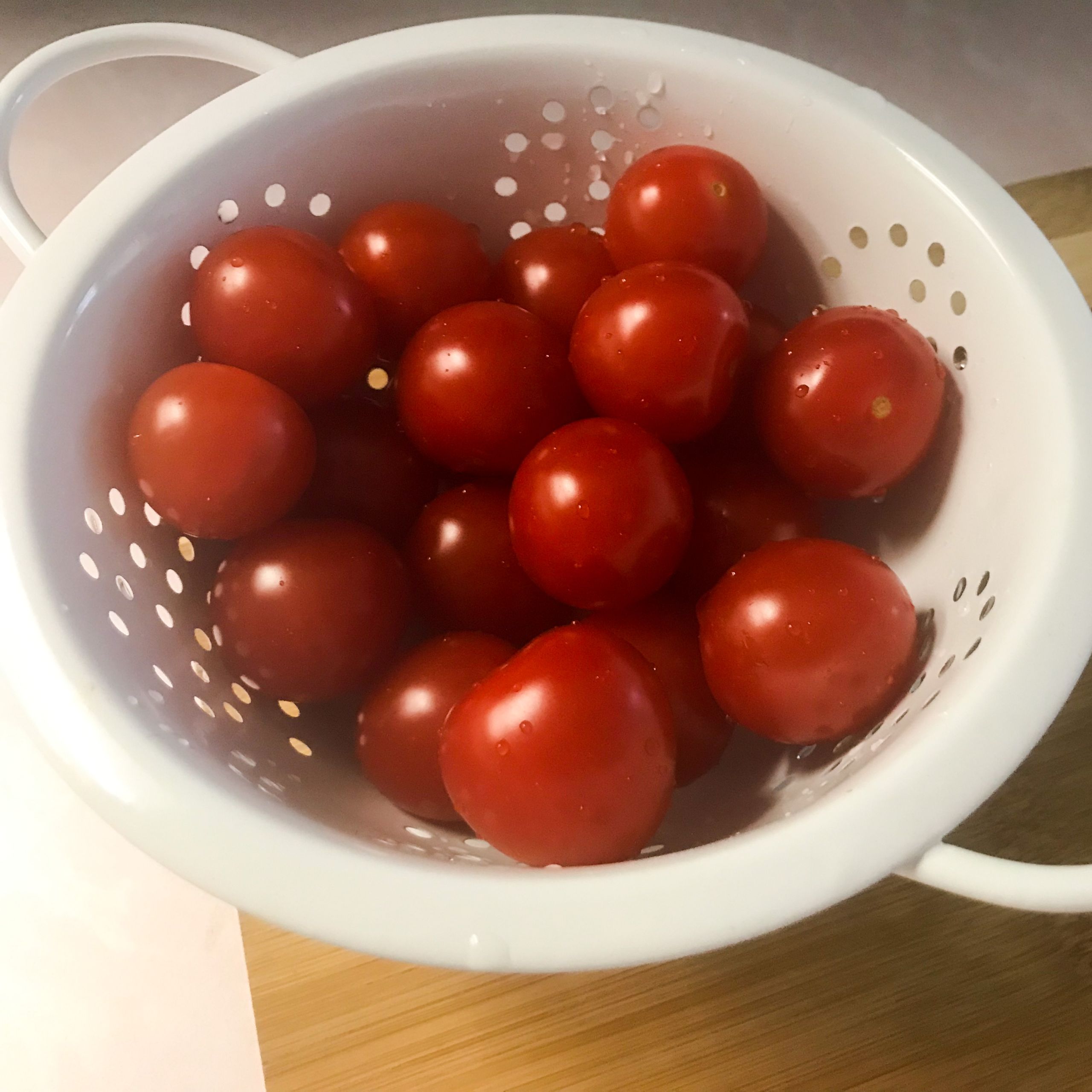 colander of cherry tomatoes