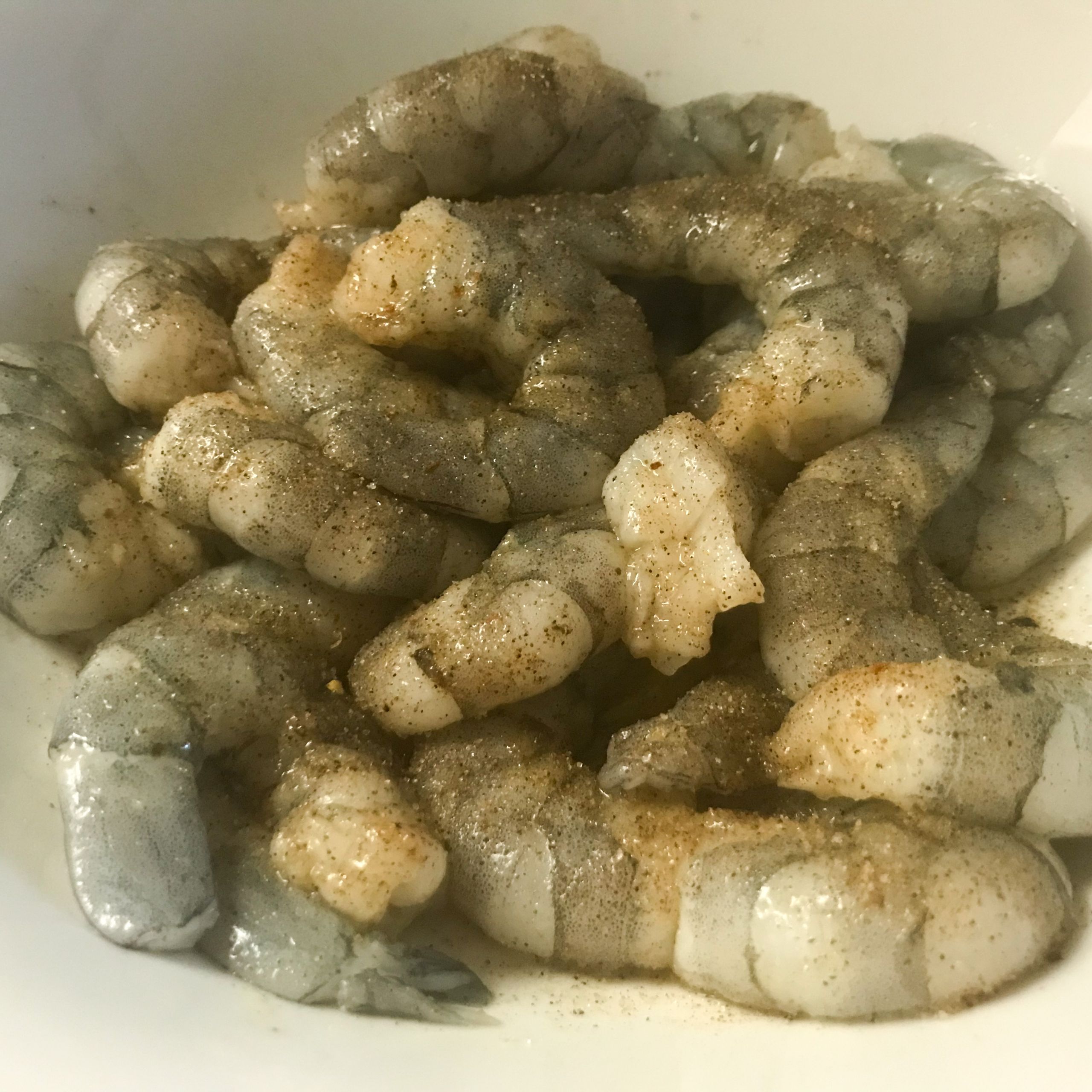 raw shrimp with seasoning in a bowl