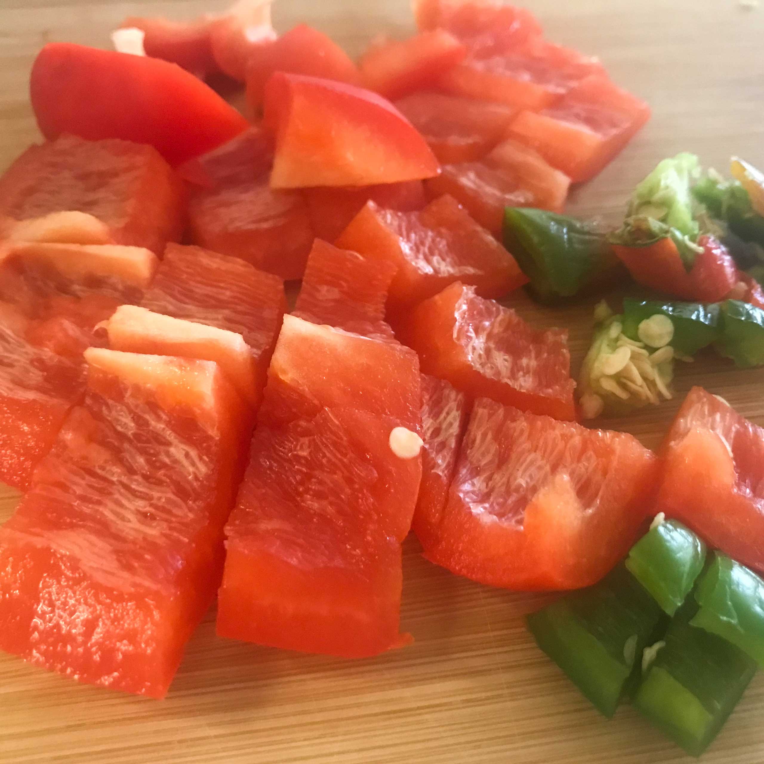 Tomato sliced for three bean hummus | My Curated Tastes