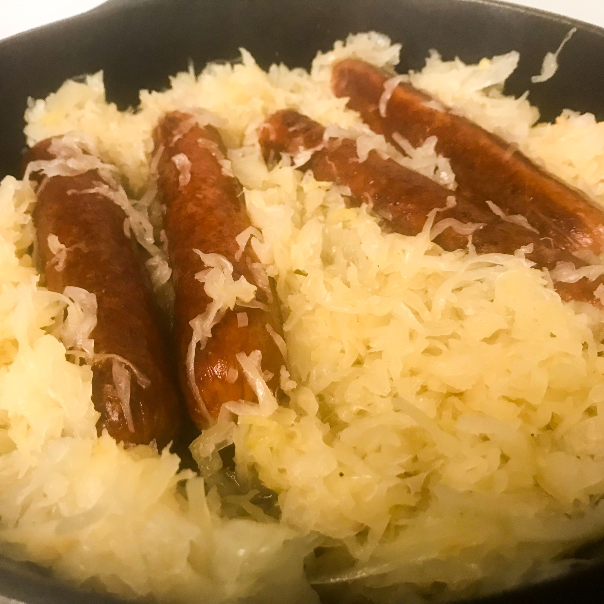 knockwurst and sauerkraut in a skillet