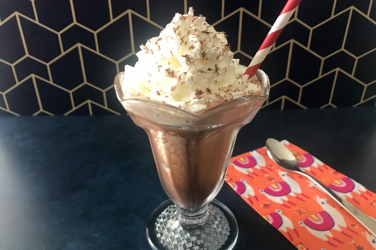 Frozen hot chocolate with a straw and spoon