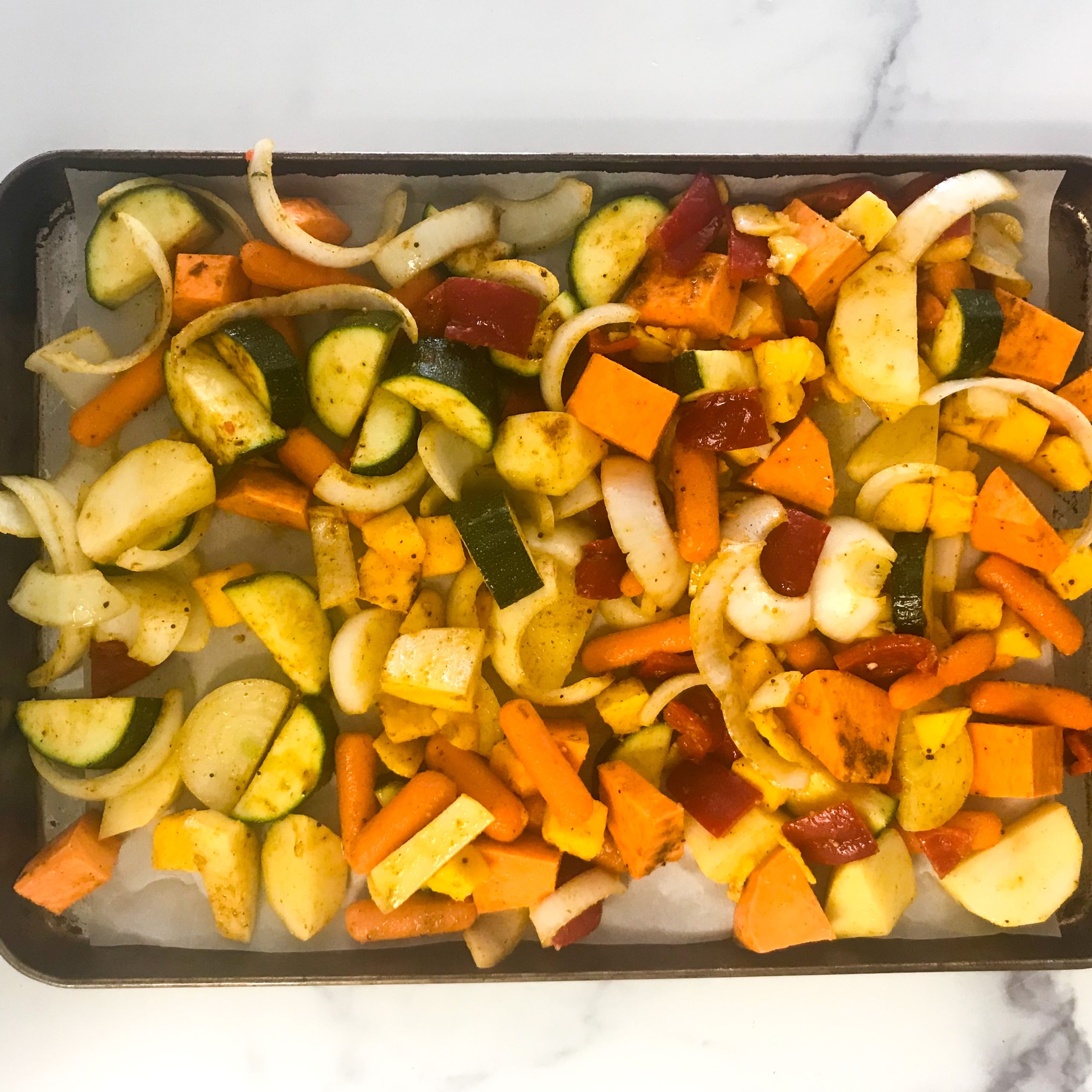 baking sheet with veggies ready for oven