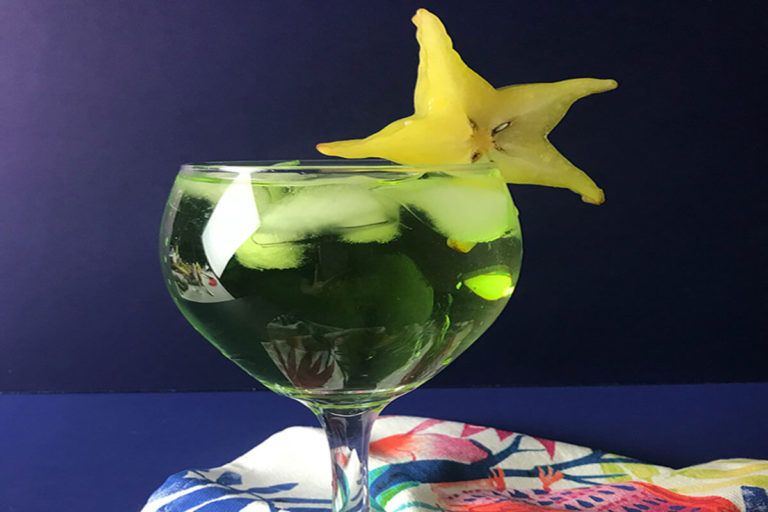 starfruit cocktail with a starfruit garnish