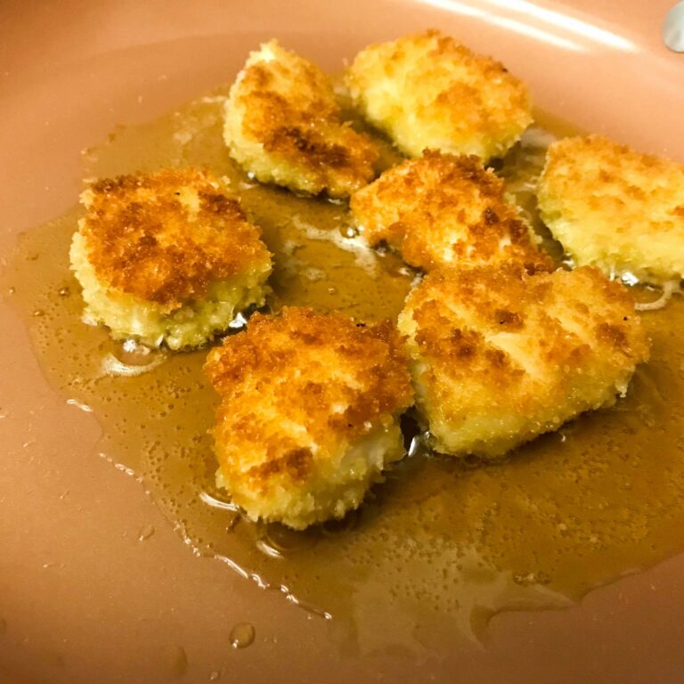 chicken croutons frying in a pan.
