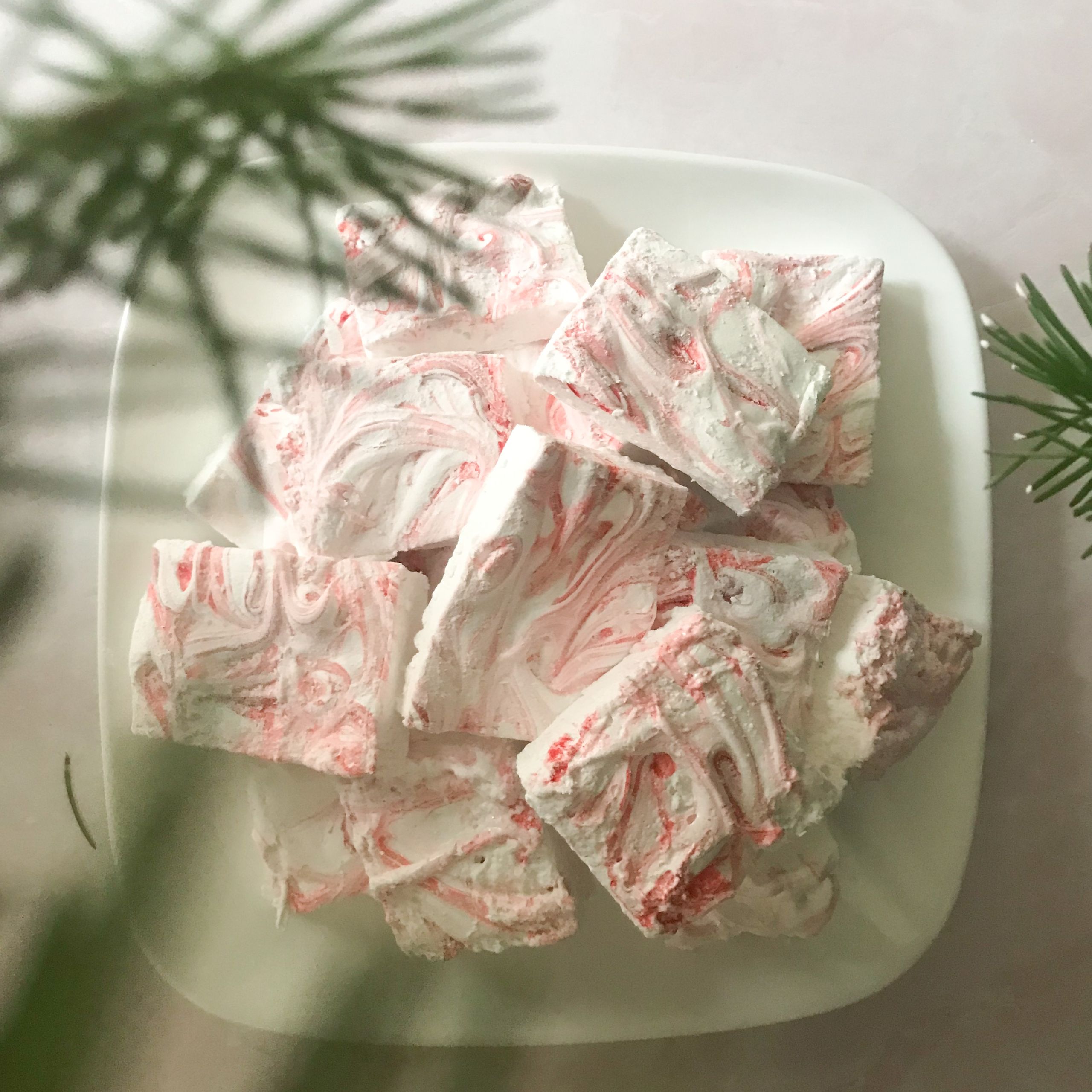 overhead view of candy cane marshmallows on a plate | my curated tastes