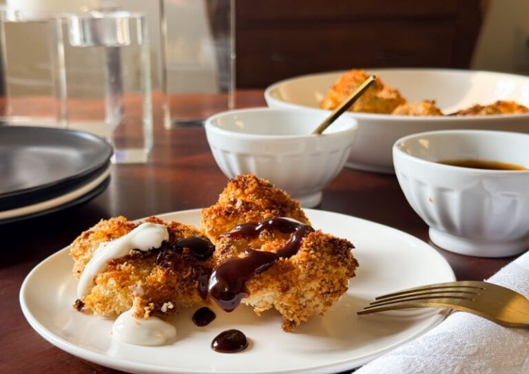 crispy cauliflower bites drizzled with two sauces.