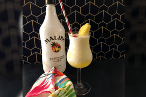 pina colada with bottle of rum.