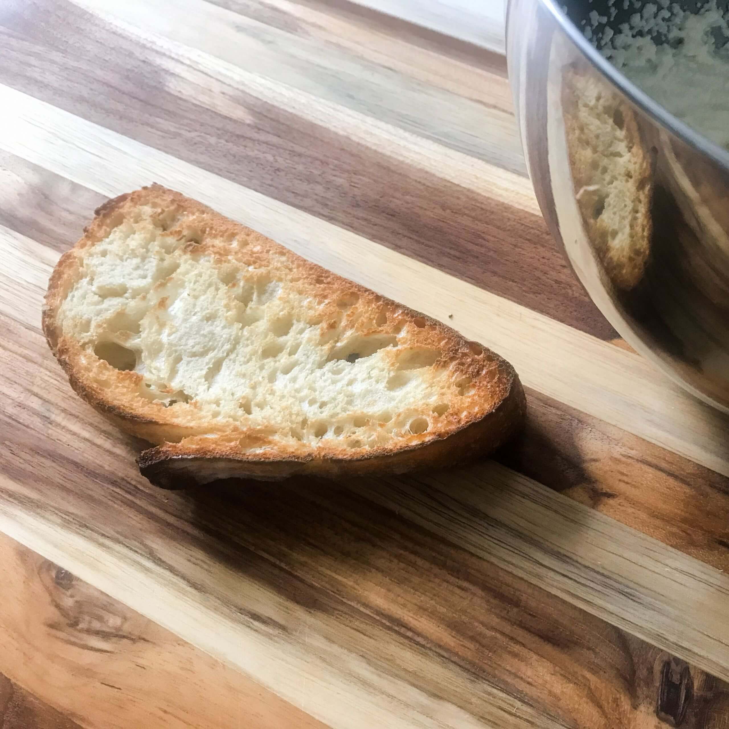 slice of toast next to bowl of whipped ricotta
