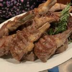 Grilled Baby Lamb Chops With Rosemary & Thyme on a platter.