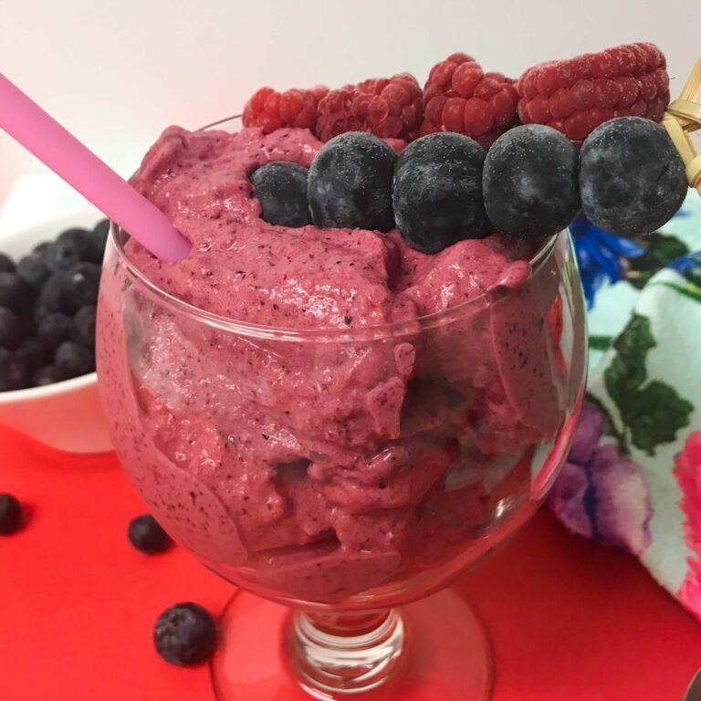 Blender Berry Sorbet topped with fruit skewers.