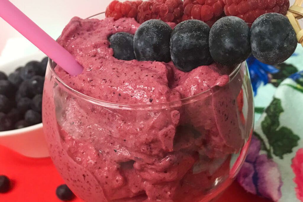 Blender Berry Sorbet topped with fruit skewers.