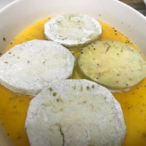 eggplant slices in egg.