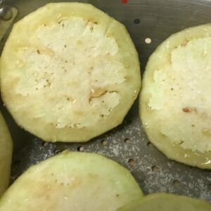 draining salted eggplant.