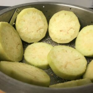 eggplant in colander salted.