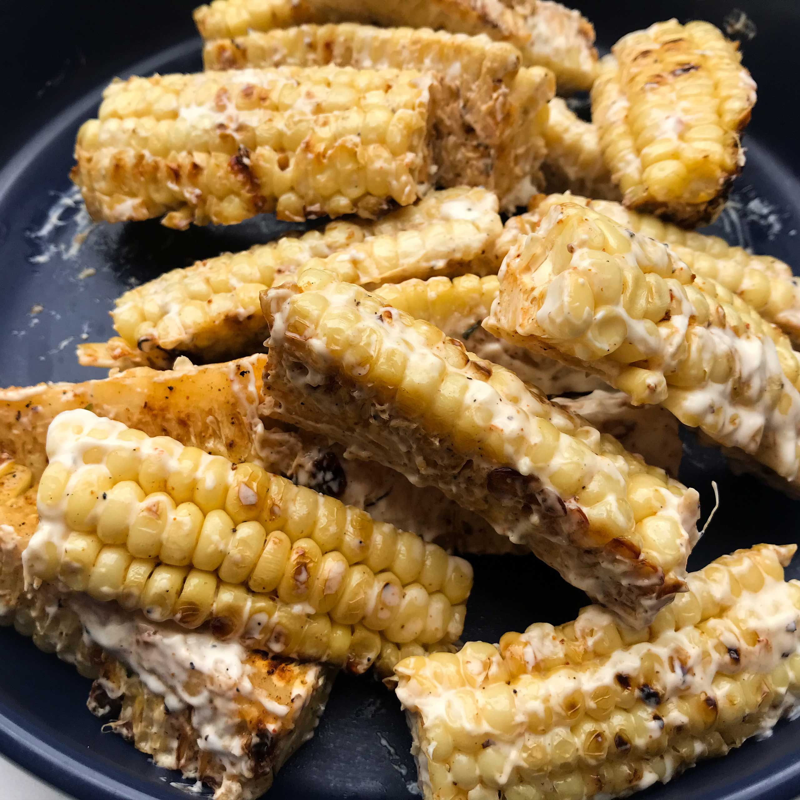 cooked corn, mixed with mayo mixture on a platter