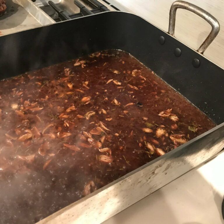 makings of gravy in roasting pan on stove