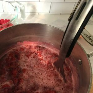 mashing berries.