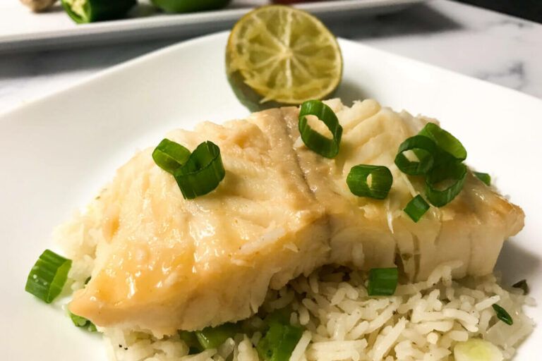 cooked cod on top of rice