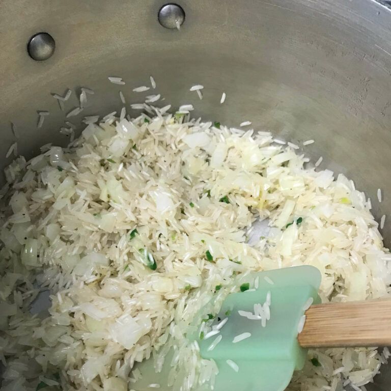 stirring rice into veggies