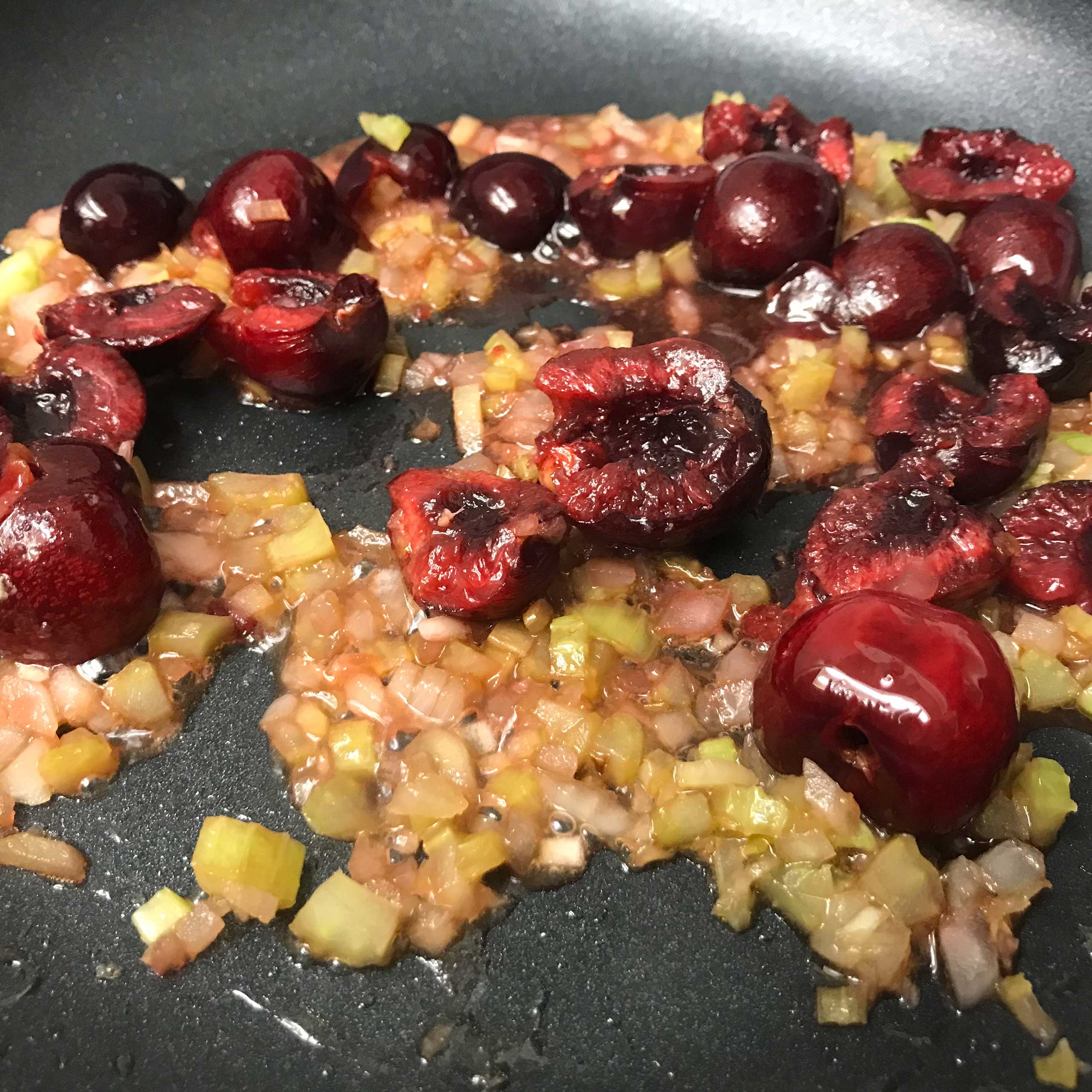 cherry sauce in skillet cooking