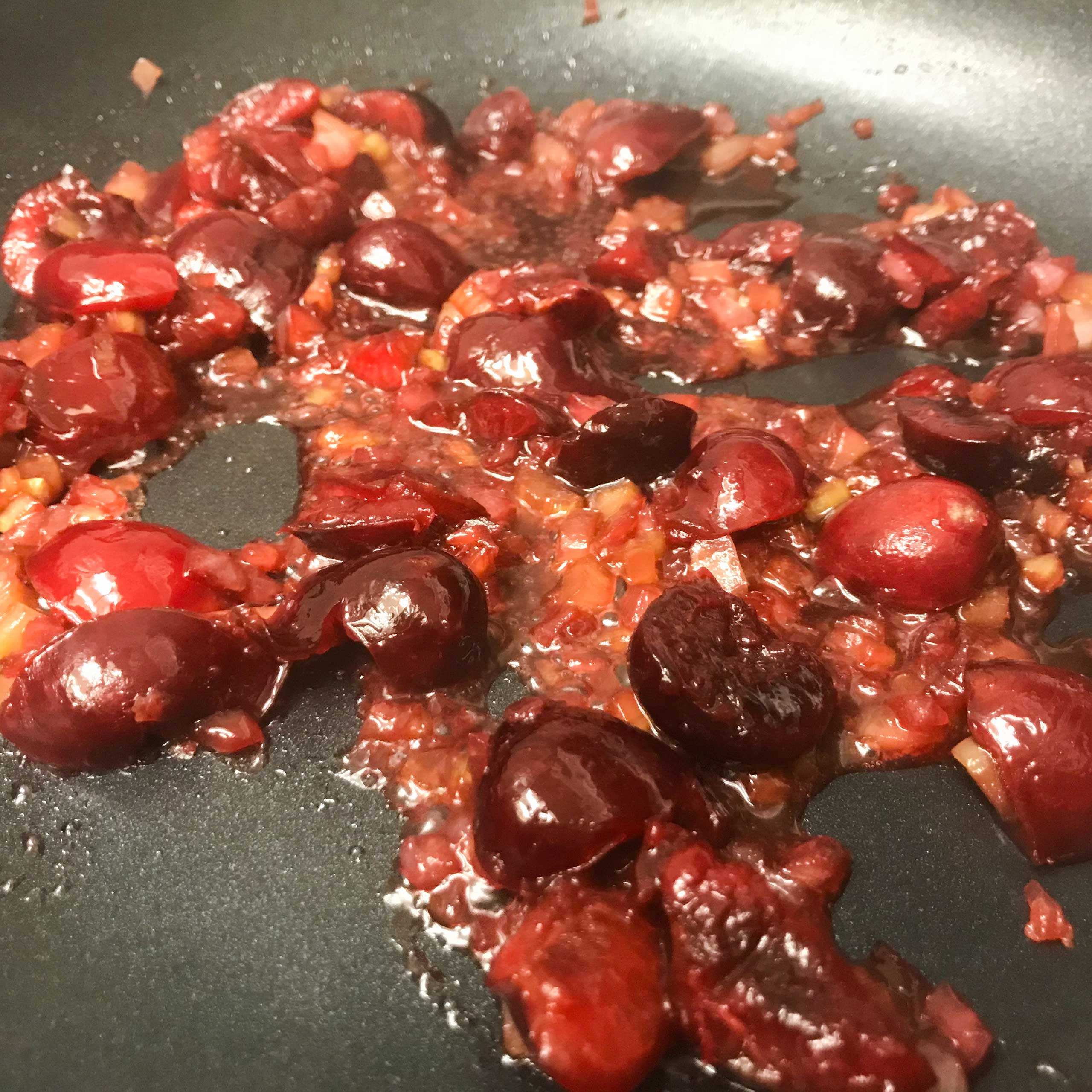 cooked down cherry sauce in skillet