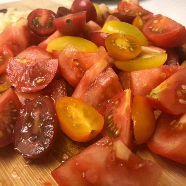 fresh chopped tomatoes on a cutting board