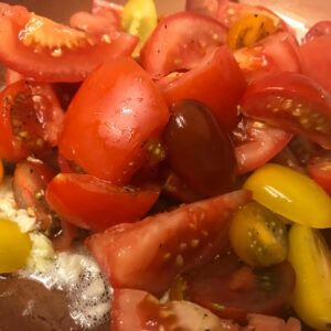 tomatoes cooking in olive oil and garlic