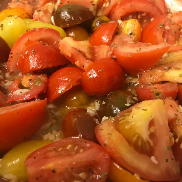 cooked tomatoes, oil and garlic with seasoning