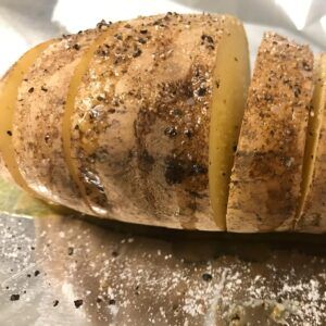 sliced potatoes with salt and pepper