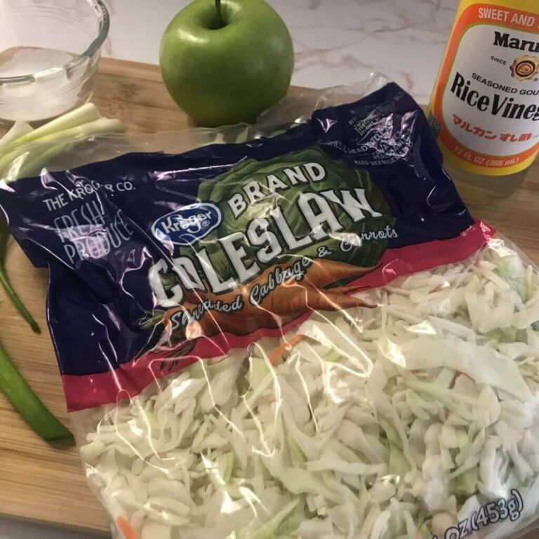 ingredients for coleslaw on a cutting board