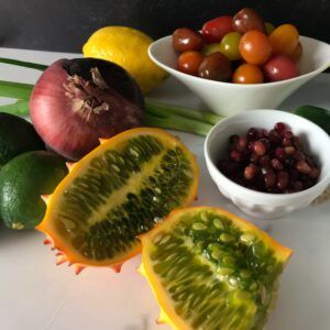 cut kiwano with other fruit and veggies