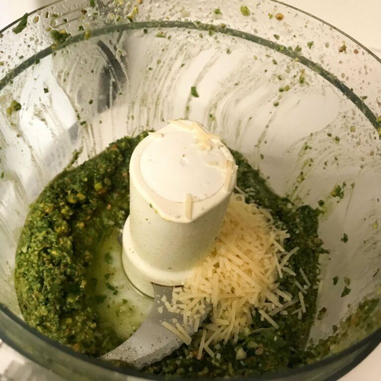 cheese added to pesto in food processor