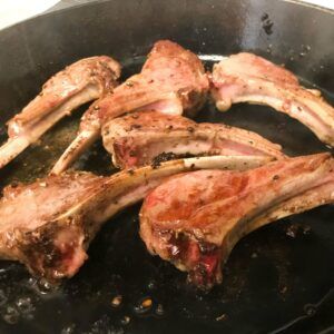 browned lamb chops in cast iron skillet