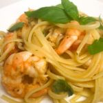 a bowl of linguine with shrimp and fresh tomato sauce