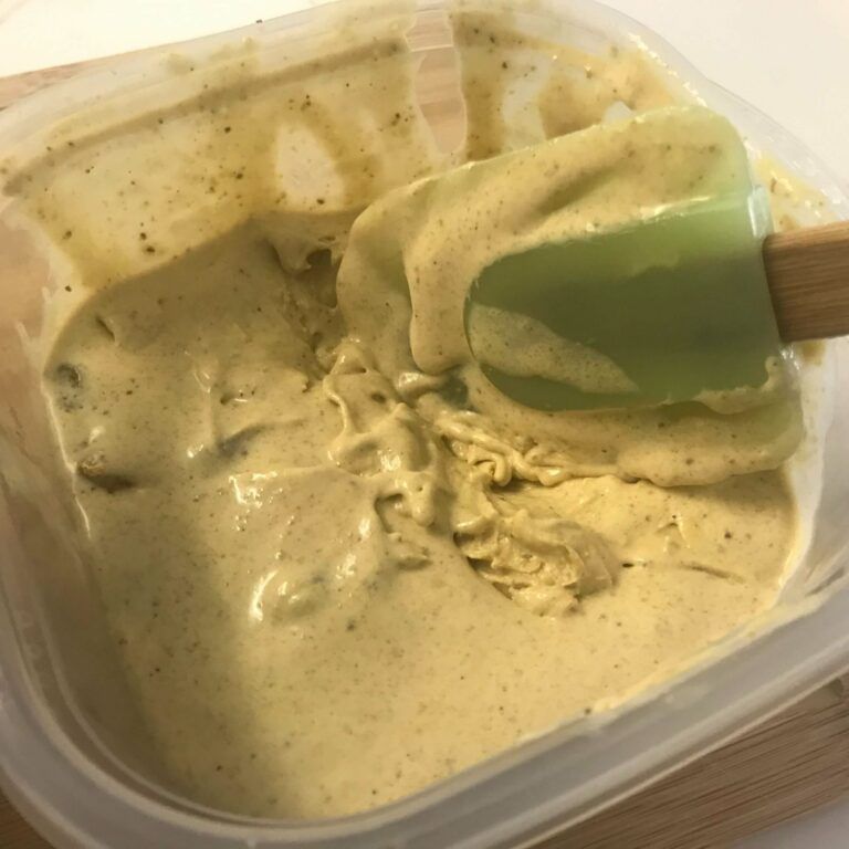 ice cream in freezer container with spatula