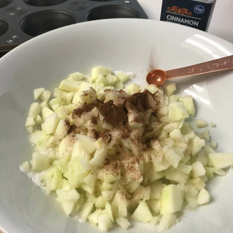 chopped apple and spices in a bowl.